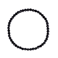 Black beaded tourmaline bracelet on a white background