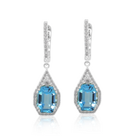 A pair of blue topaz earrings with white gold and diamond accents.