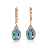 A pair of blue topaz earrings with rose gold and diamond accents.