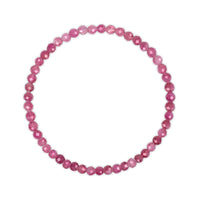 Pink beaded bracelet on a white background
