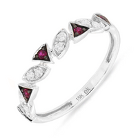 A gold ring with alternating red ruby and clear diamond stones, featuring a band design.