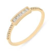 18kt ring with diamonds on the band on white background