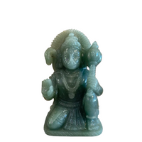 green aventurine carvingof hanuman the hindu monkey god on white background