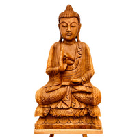 Wooden Buddha statue on a white background