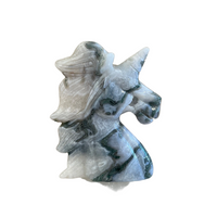 Decorative moss agate stone carving of a unicorn on a white background