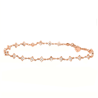 Gorgeous rosegold chain bracelet strewn with 18 quatrefoil designs with diamond centers