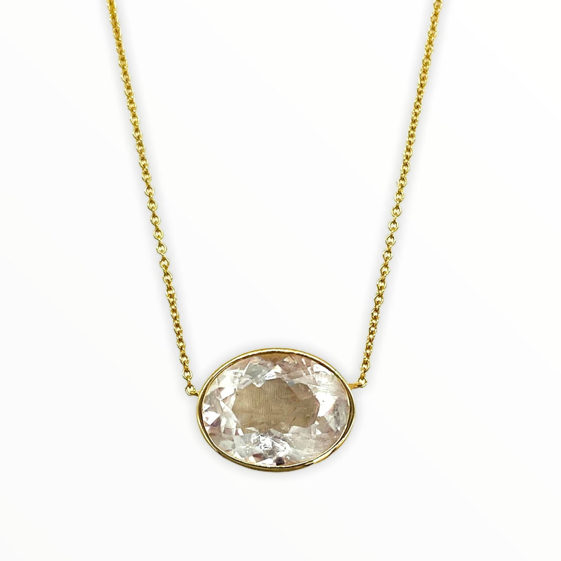 gold necklace with bright irredescent oval-shaped, bezel-set faceted morganite gemstone
