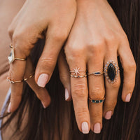 woman's hands wearning multile rings