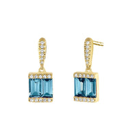 Gold earrings each with double blue topaz baguettes surrounded by diamonds- Ele Keats Jewelry