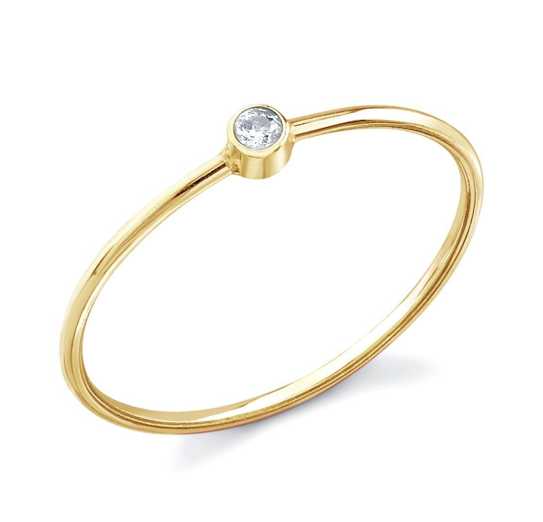 18 kt gold ring with single round bezel set diamond