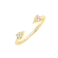 an open gold ring with arrow dsigns that point at each other but don't meet