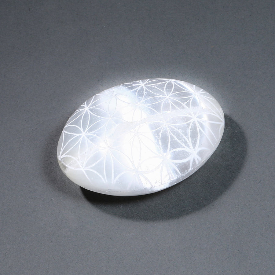 White stone with floral patterns on a gray background