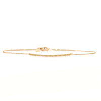 A yellow gold bracelet with a barrette closure, featuring yellow sapphire accents.