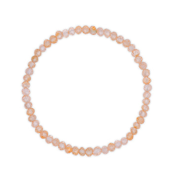Bracelet with golden citrine faceted beads on a white background