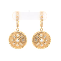 A pair of gold drop earrings with geometric patterns and embedded diamonds throughout.