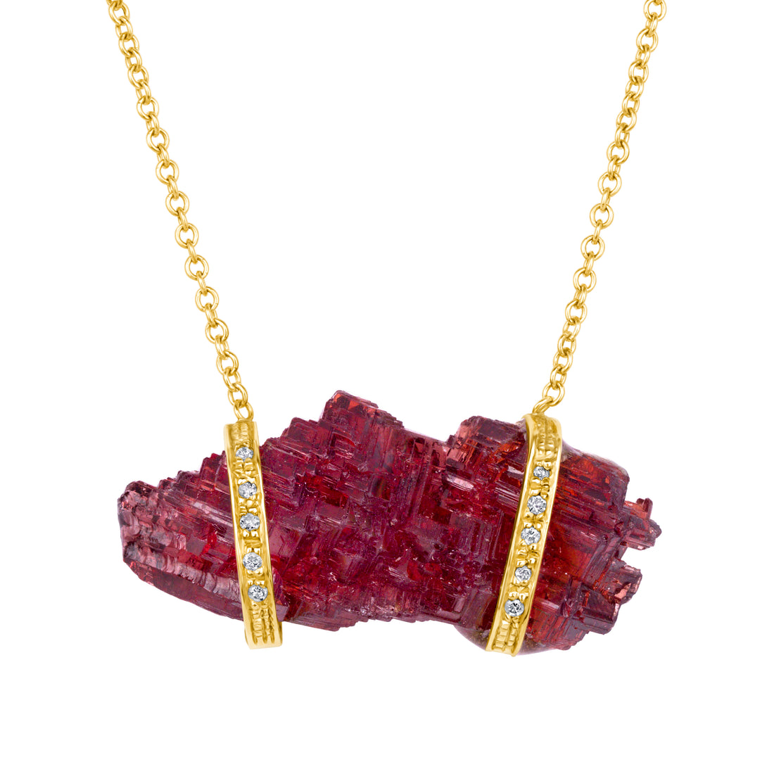 Necklace with a red crystal pendant and gold chain on a white background