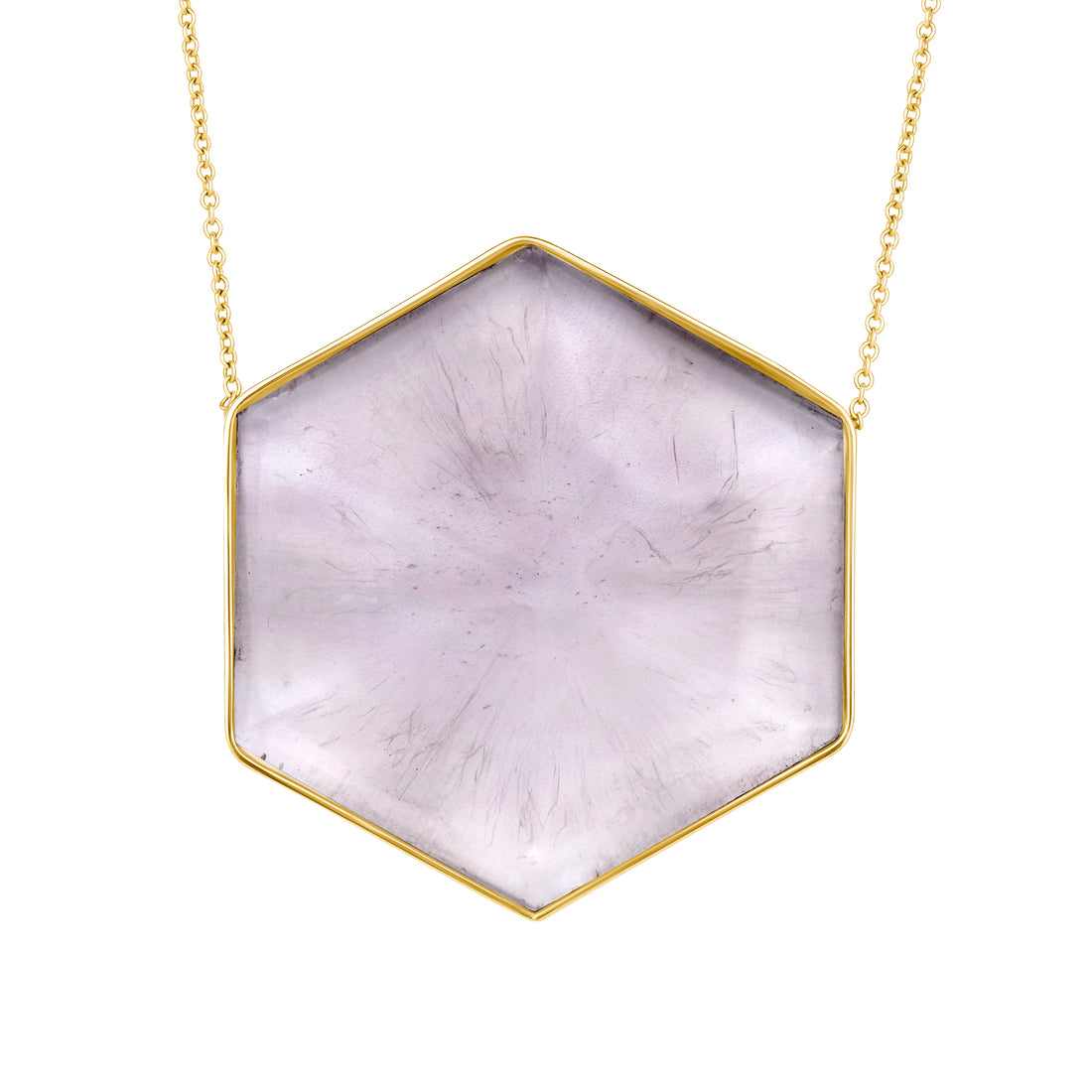 Hexagonal stone pendant on a gold chain against a white background