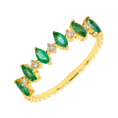 Stunning 18k gold band featuring six oval emeralds separated with accent diamonds.