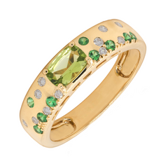 A gold ring featuring a peridot centerpiece with green garnet and white diamond accents.