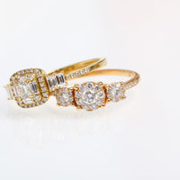 2 18kt Gold and diamond rings with diamond accents on a light gray background