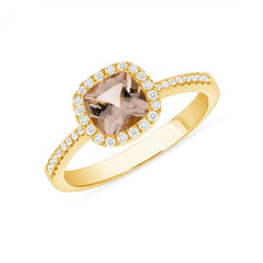 18k gold ring with a cushion-cut Morganite bezel-set in diamonds.