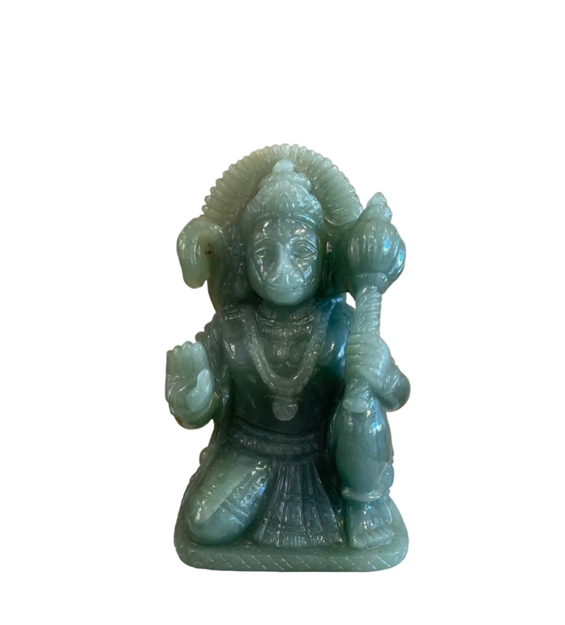 green aventurine carvingof hanuman the hindu monkey god on white background