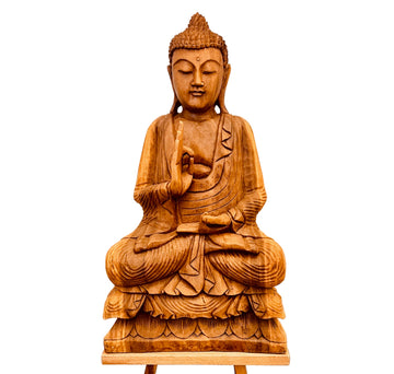 Wooden Buddha statue on a white background