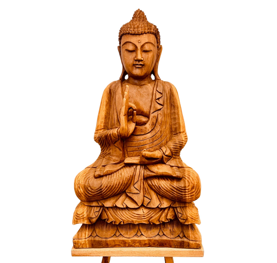 Wooden Buddha statue on a white background