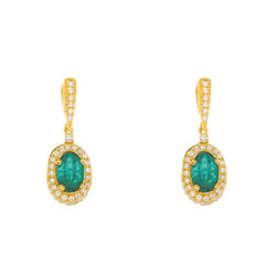 Gold earrings with emerald gemstones and diamonds on a white background