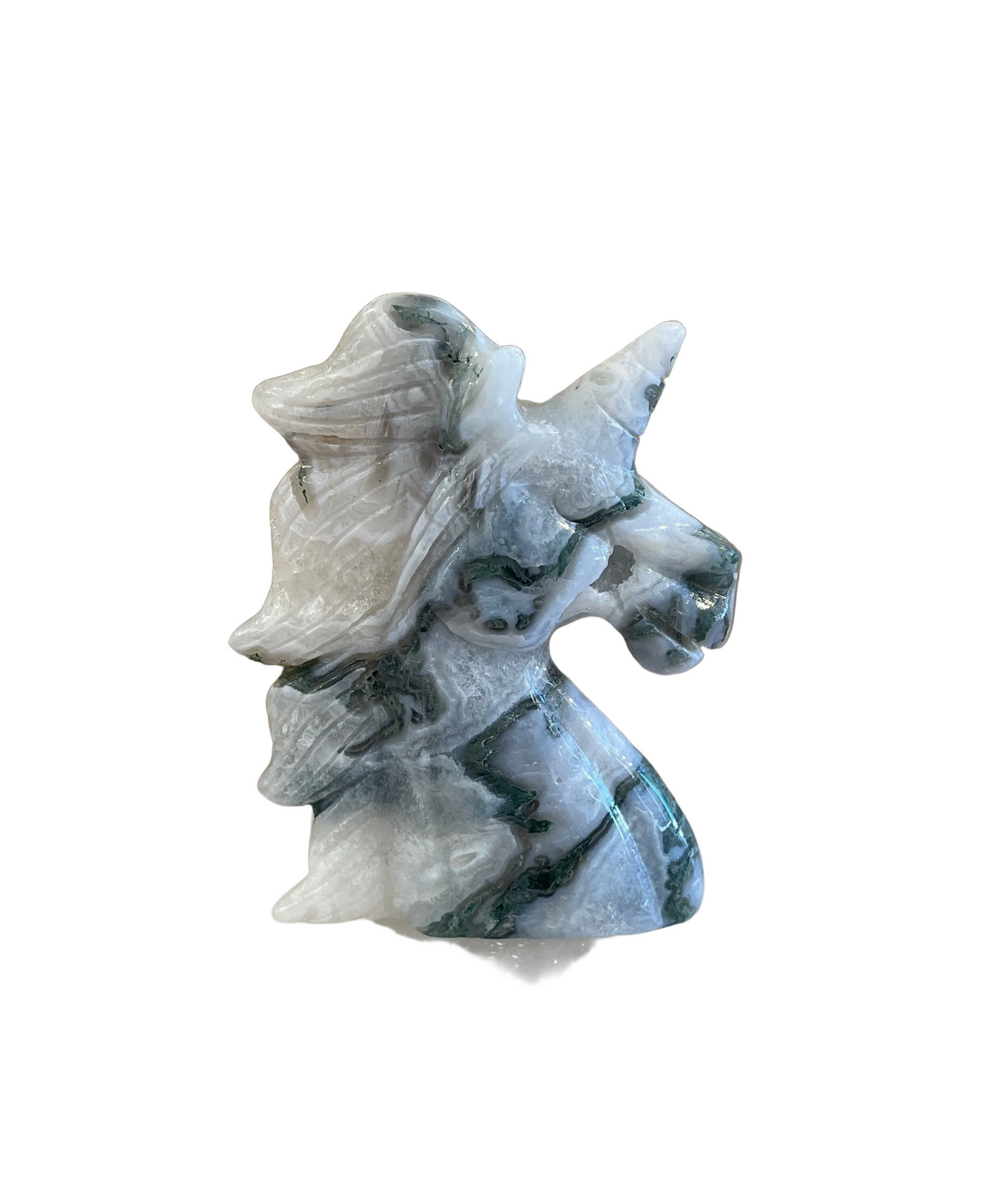Decorative moss agate stone carving of a unicorn on a white background