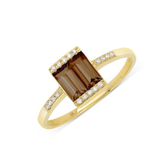 Gold ring with double exquisite smoky quartz baguettes flanked with brilliant diamonds and small round diamonds down the band.