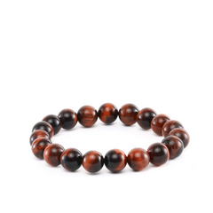 Brown and reddish beaded bracelet on white background