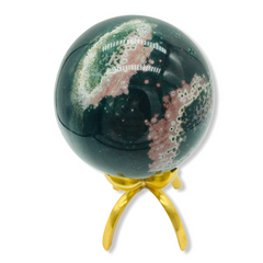 green ocean jasper sphere with swaths of pink on brass stand with white background