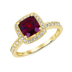 Gold ring with a cushion-cut wine colored Rhodolite gemstone, haloed in radiant diamonds with additional pavé diamonds cascading down the band 